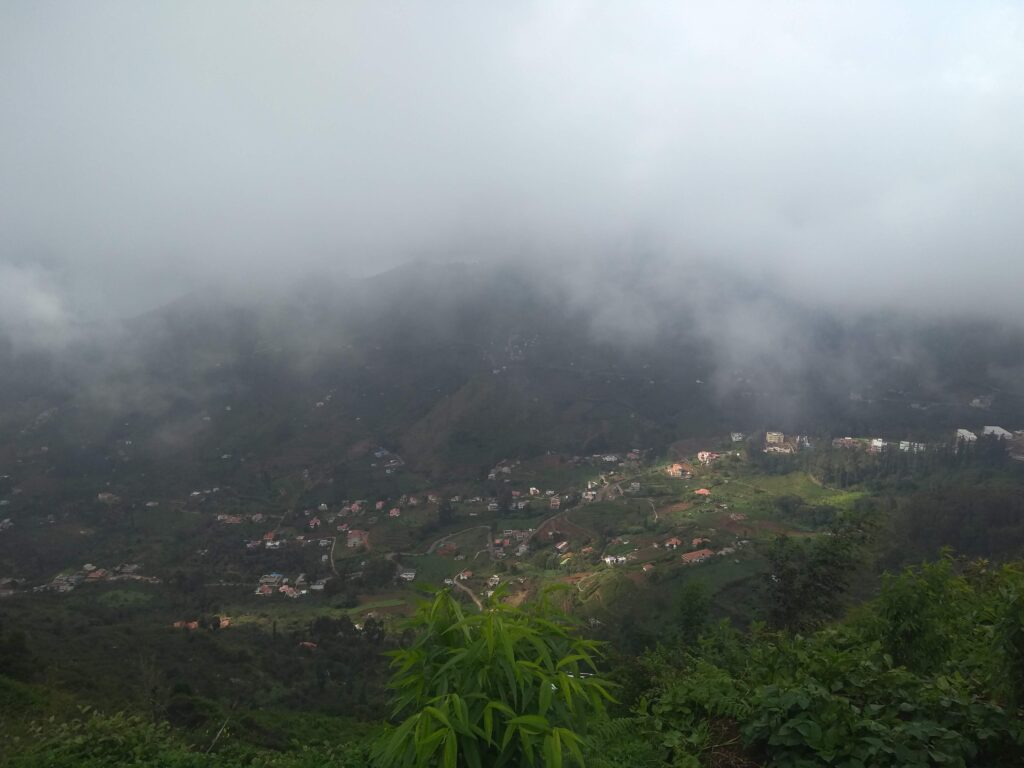 The fog in Kodaikanal often blankets the landscape during early mornings and evenings